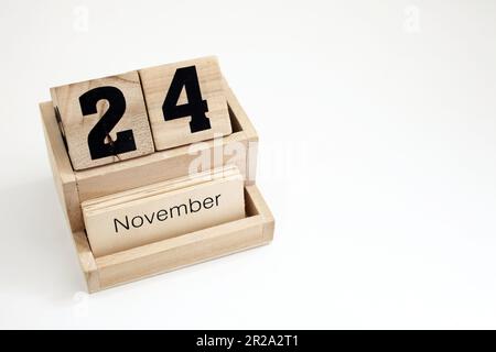 Calendrier perpétuel en bois montrant le 24th novembre Banque D'Images