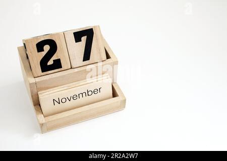 Calendrier perpétuel en bois montrant le 27th novembre Banque D'Images
