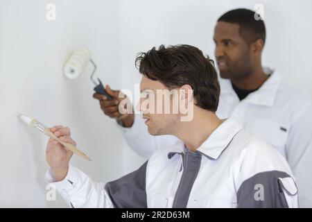 deux peintres dans leur uniforme Banque D'Images