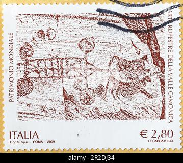 Dessins rock de Valcamonica sur timbre-poste italien Banque D'Images