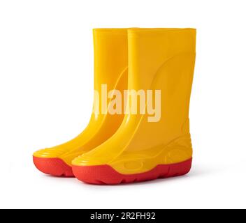 bottes en caoutchouc jaune isolées sur fond blanc Banque D'Images