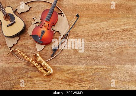 Bonne journée mondiale de la musique. Instruments de musique avec fond de globe. Banque D'Images