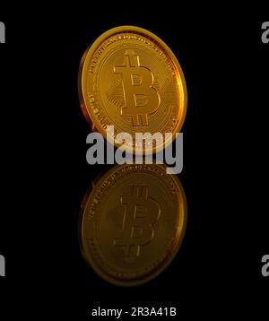 Pièce d'or isolée avec fond noir Banque D'Images