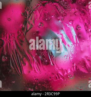 Arrière-plan abstrait de l'huile mélangée à de l'eau de différentes couleurs variations Banque D'Images