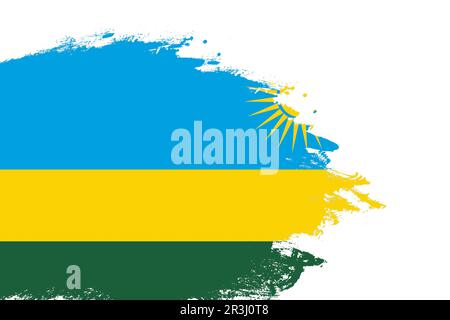 Drapeau rwandais sur un pinceau coloré peint sur fond blanc isolé avec espace de copie Banque D'Images