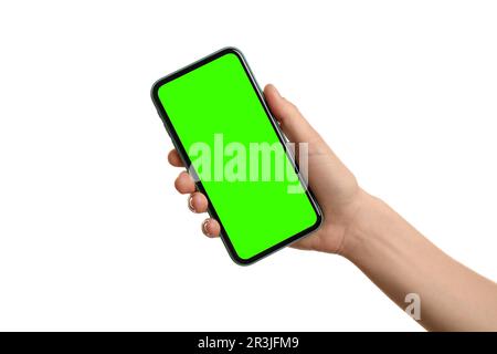 Jeune femme tenant un smartphone avec écran vert sur fond blanc, gros plan. Maquette pour le design Banque D'Images
