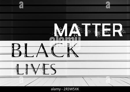 TEXTE NOIR SUR fond noir et blanc. Concept des droits de l'homme. Protestation contre la fin du racisme. Banque D'Images