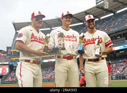 Los Angeles Angels players, from left, Jo Adell, Jimmy Herget, Shohei  Ohtani and Max Stassi celebrate after a baseball game against the Seattle  Mariners, Friday, Aug. 5, 2022, in Seattle. The Angels