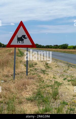 Panneau de signalisation indiquant Warthogs, Namibie Banque D'Images