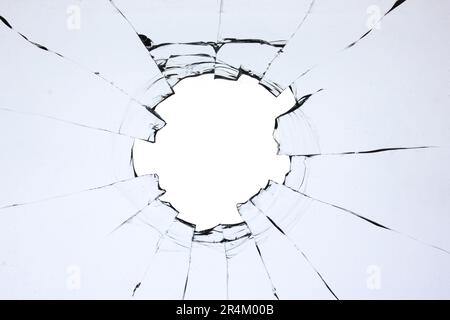 Trou dans le verre, fenêtre cassée avec une texture craquelée. Effet du verre transparent cassé Banque D'Images