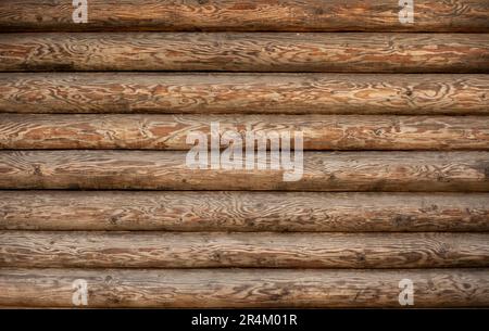 Arrière-plan d'un mur en bois d'une maison en poutre ronde Banque D'Images