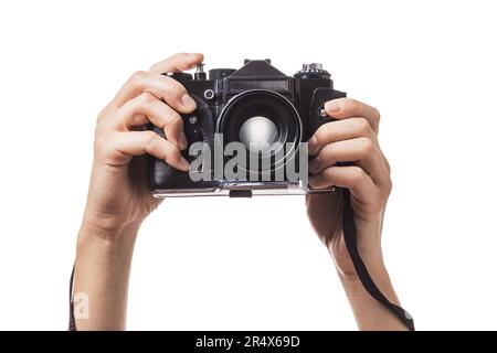 Caméra dans les mains isolée sur fond blanc Banque D'Images