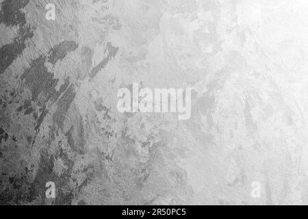 Mur en béton recouvert de plâtre vénitien blanc gris décoratif, vue frontale. Texture de la photo d'arrière-plan Banque D'Images