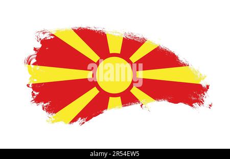 Drapeau national de la Macédoine du Nord peint avec un pinceau sur blanc isolé Banque D'Images