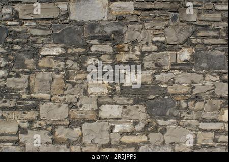 Photo en gros plan d'un mur en pierre naturelle avec un beau motif. Banque D'Images