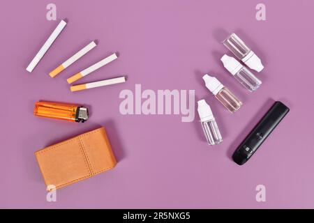 Comparaison entre la cigarette électronique et la cigarette réelle avec les outils Banque D'Images