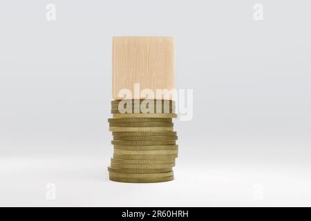 Pile de pièces de monnaie dorées surmontée d'un bloc de bois qui sert d'espace de copie. Illustration de la notion de finances et de questions liées à l'argent Banque D'Images