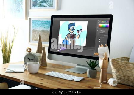 Le lieu de travail d'Animator. Ordinateur moderne avec illustration à l'écran Banque D'Images