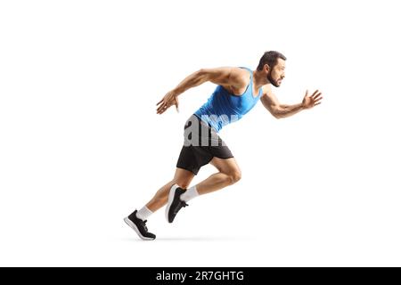 Photo de profil sur toute la longueur d'un athlète masculin en forme rapide, isolé sur fond blanc Banque D'Images