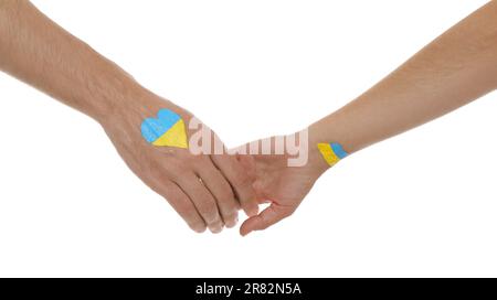 Homme et femme avec des drapeaux ukrainiens peints sur leurs mains sur fond blanc, gros plan Banque D'Images