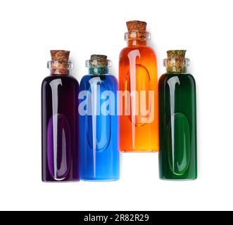 Flacons en verre avec différentes couleurs alimentaires sur fond blanc, vue de dessus Banque D'Images