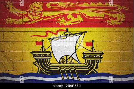 Drapeau du Nouveau-Brunswick peint sur un mur de blocs de cinder. Banque D'Images