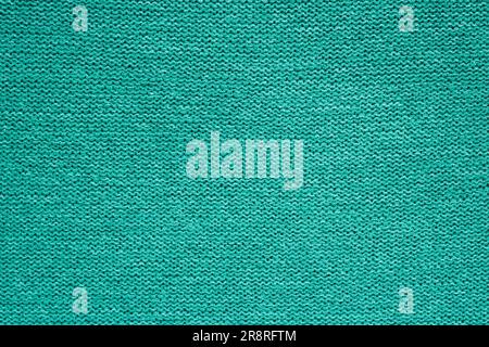 Toile de fond tricotée d'un fil vert, motif uniforme. Banque D'Images