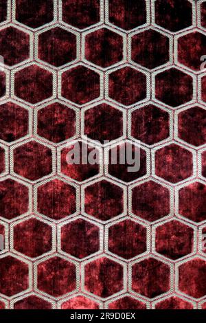 Fragment de velours fébrique avec formes hexagonales, fond de texture textile de luxe Banque D'Images