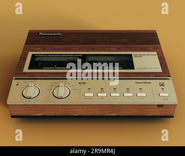 Un rendu 3D d'un répondeur Panasonic d'époque des années 80 sur fond jaune moutarde - 07 juin 2023 à Bristol, Royaume-Uni Banque D'Images