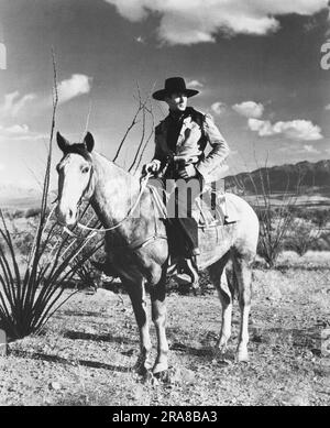 Hollywood, Californie: Gary Cooper, 1940 star de cinéma de l'Ouest, dans une photo promotionnelle pour le film, 'The Westerner'. Banque D'Images