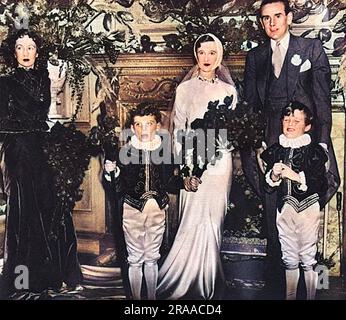 M. Alec Hambro et sa mariée Barbara (Baba) Beaton, photographiés lors de leur réception de mariage qui s'est tenue dans la maison de Mme Cunningham-Reid, à Upper Brook Street, Londres. Ils sont accompagnés de Mlle Tess Chattock, une demoiselle d'honneur, et de deux serviteurs, E.Hambro et Michael Cunningham-Reid. Date: 06-nov-34 Banque D'Images