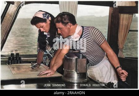 Jean Simmons et Donald Houston sur place pour le film, The Blue Lagoon (sorti en 1949). Vu ici en traçant leur position sur le navire, Royal Flight. Date: Vers 1949 Banque D'Images