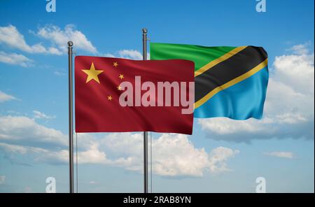 La Tanzanie et le drapeau de la Chine agitant ensemble dans le vent sur le ciel bleu, deux concept de coopération de pays Banque D'Images