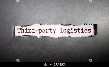 Texte LIVRAISON PAR UN TIERS écrit sur un livre blanc avec un stylo et des lunettes sur un clavier d'ordinateur.concept d'entreprise. Banque D'Images