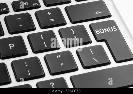 Bouton avec mot Bonus sur le clavier de l'ordinateur portable, gros plan Banque D'Images