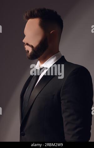 Anonyme. Homme sans visage en costume sur fond sombre Banque D'Images