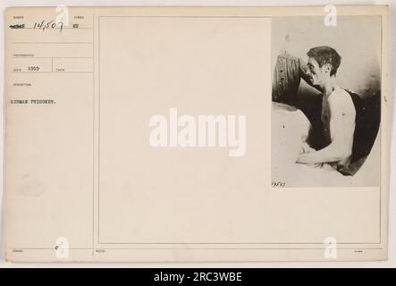 L'image montre un prisonnier allemand capturé pendant la première Guerre mondiale La photographie a été prise en 1919 par le photographe nomote et est identifiée par le numéro 111-SC-14507. Cette image est une description officielle émise par l'armée et fait partie de la collection de photographies documentant les activités militaires américaines pendant la guerre. Banque D'Images