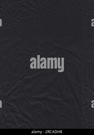 Papier de soie froissé noir sans couture endommagé comme arrière-plan. Tissu d'emballage déchiré Banque D'Images