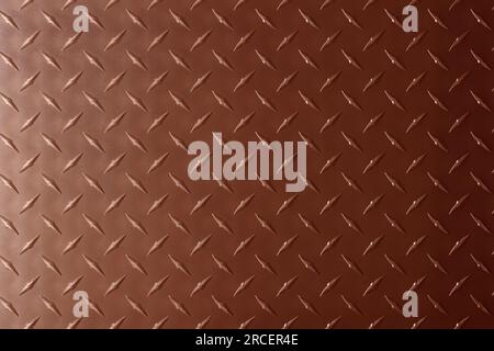 plaque de texture en cuivre avec imprimé losanges. feuille de métal, fond en bronze. Banque D'Images
