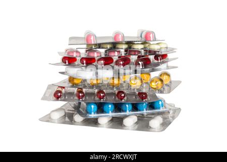 Trop de cartouches de pilules différentes empilées. Focus sélectif. Boîtes de comprimés de plaquette thermoformée avec comprimés. Paquets de pastilles de couleur. Une pile de médicaments en bl Banque D'Images