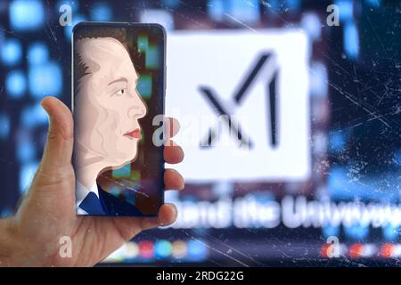 2023 Elon Musk Portrait sur un smartphone Tap et un Xai flou Banque D'Images
