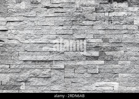 Façade naturelle décoration en pierre quartzite fond texture. Mur moderne en pierre de granit Banque D'Images