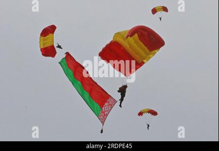 Minsk, Belarus. 22nd July, 2023. Parachute athletes demonstrate Belarusian national flag to celebrate the 170th anniversary of Belarus' fire service in Minsk, Belarus, July 22, 2023. Festive events dedicated to the 170th anniversary of Belarus' fire service were held in Minsk on Saturday. Credit: Henadz Zhinkov/Xinhua/Alamy Live News Stock Photo