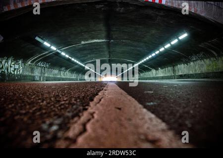 Duisburg, Germany. 23rd July, 2023. View into the tunnel at the scene of the accident. On July 24, 2010, 21 people between the ages of 17 and 38 were crushed at the only entrance and exit to the technoparade. At least 652 Love Parade visitors were injured at the time. Every year, the surviving relatives commemorate the victims. Credit: Christoph Reichwein/dpa/Alamy Live News Stock Photo