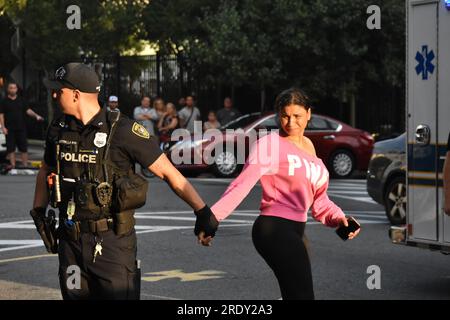 Union City, United States. 23rd July, 2023. Police officer walks with a woman related to the hostage situation incident. Hostage situation reported in Union City. At approximately 5:30 PM, Sunday evening a hostage situation was reported. It was reported that there was one person holding another hostage in a residence. Around 7:30 PM, the situation was under control and an all clear was given. One female was seen being transported to an undisclosed location by EMS. The Union County Regional SWAT Team responded to the scene. Credit: SOPA Images Limited/Alamy Live News Stock Photo