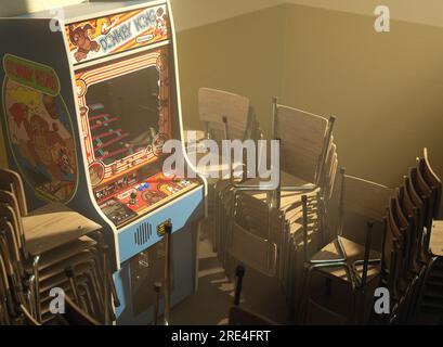 Une armoire de jeux vidéo d'arcade Nintendo Donkey Kong sur un mur jaune dans une pièce flanquée de chaises empilées éclairées par une lumière de fenêtre - 25 juillet 2023 Banque D'Images