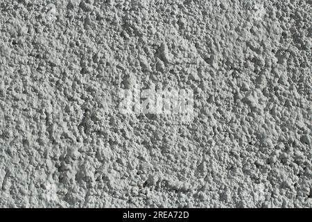 Mur blanc. Surface rugueuse. Irrégularités sur le mur. Détails du bâtiment. Banque D'Images