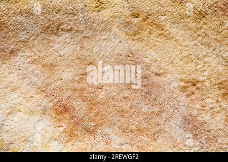 Texture de fond de pierre. Vieux mur ou sol en pierre beige vieilli, motif rocheux Banque D'Images