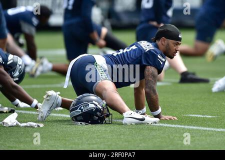 Seattle Seahawks wide receiver Jaxon Smith-Njigba (11) stands with  teammates including tight end Will Dissly (89) and tight end Colby  Parkinson (84) May 22, 2023, at the team's NFL football training facility