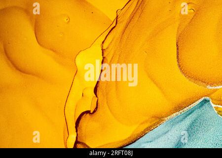Design abstrait d'encre d'alcool en orange et jaune Banque D'Images